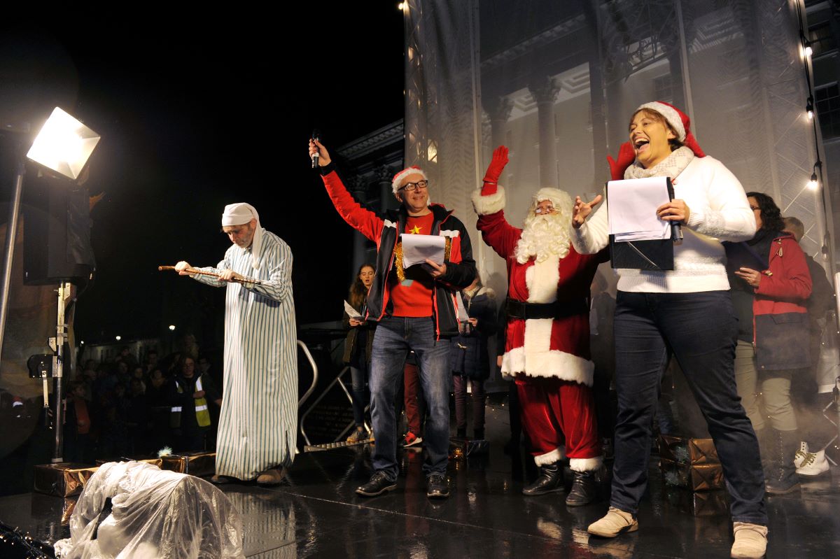 Scrooge with presenters Dom and Nicky from BBC Radio Glos on stage